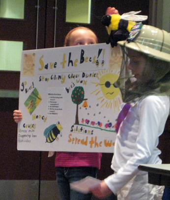 girls presenting on bees