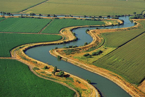 aerial view of field crops divded by serpentine water channel