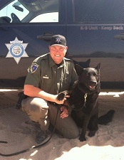 Warden Rodney Nemlowill and K-9 Buddy