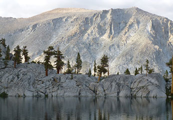 Bighorn habitat in the background of a magnificent alpine lake.