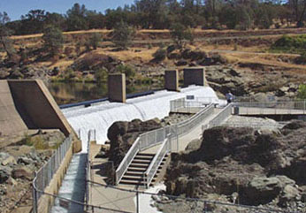 view of fish ladder and viewing platform next to weir on river