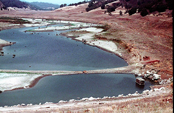 (Figure 2. Uvas Reservoir in the summer of 1977. Photo courtesy of Dr. Jerry Smith, San Jose State University.)