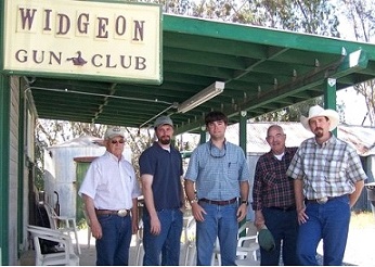 five men by Widgeon Gun Club building