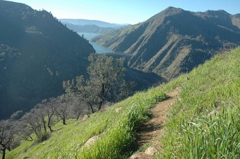 view of ridge trail at Putah Creek WA, with Lake Berryessa in the distance