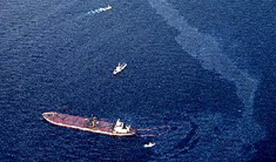 aerial view of ship leaking oil into water