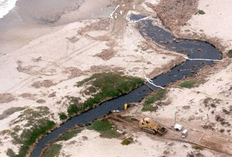 aerial viw of a creek with boom over it in several locations
