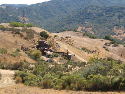 remains of a mine nestled in rolling hills