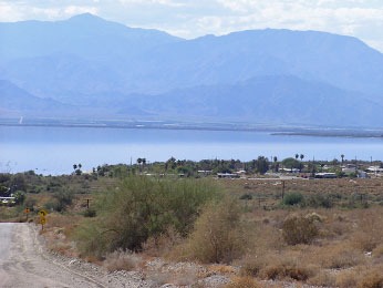 broad view of desert and mountains surrounding a lake